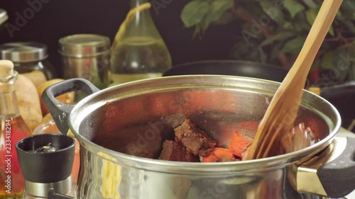 Cooking irish stew, inside a metal pot
