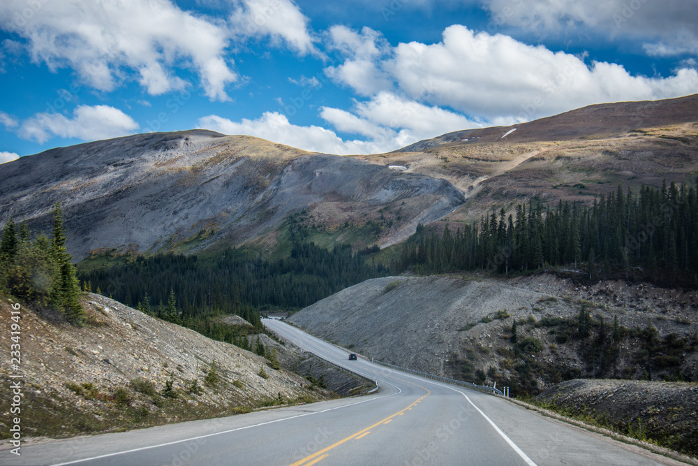 Highway road in the Icefields Parkway in Jasper and Banff National Parks in Alberta Canada, in the Canadian Rockies Highway road in the Icefields Parkway in Jasper and Banff National Parks in Alberta Canada, in the Canadian Rockies