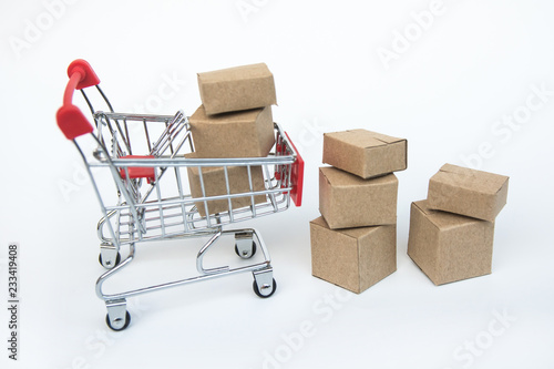 Shopping cart with carton on white background.