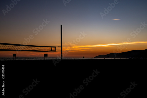 Volleyball net on sunset