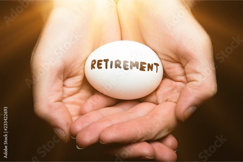 Cupped Hands Holding Egg With the Inscription "Retirement" on