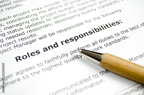 Roles and responsibilities with wooden pen photo