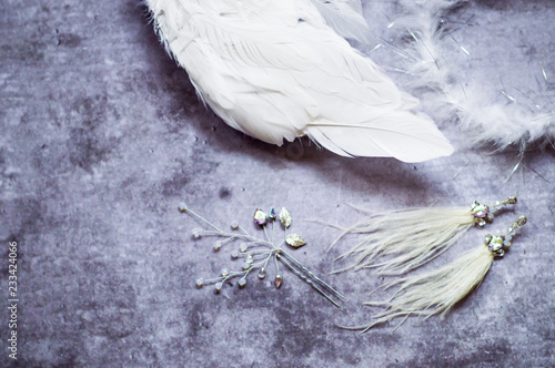 Accessories for accessories for parties on February 14: the image of an angel lbi, wings, a nimbus, earrings from ostrich feathers, a cristavo stud. Flat lay, top view, copy space, square photo