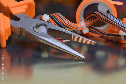 Electrical tool and components on metallic background