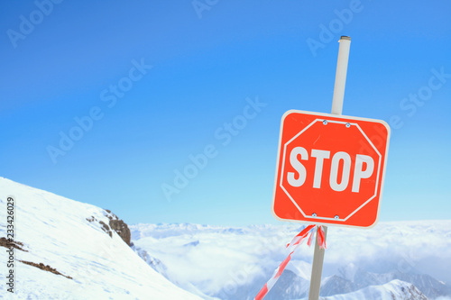 Marking of ski slopes. Closed slope with stop sign. Caucasus Mountains, Georgia, ski resort Gudauri. © biotin
