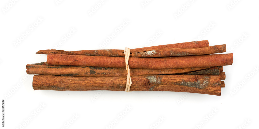 Macro Foto of Dry Cinnamon Sticks Isolated on White Macro Foto of Dry Cinnamon Sticks Isolated on White