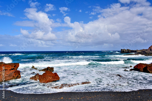Waves crashing on the rugged coastline. Lanzarote, Canary Islands, Spain