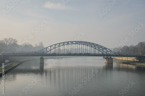 Bridge over the river in the fog