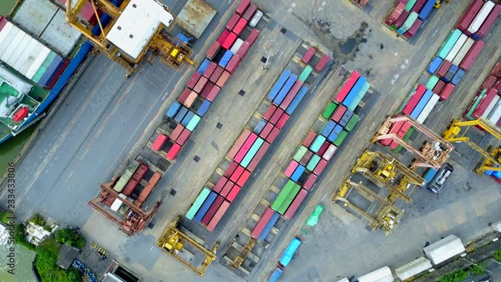 4K. Logistics and transportation of container cargo freight ship with container crane in shipyard. Logistic import export business and transport industry. Aerial view taken from drone. 4K. Logistics and transportation of container cargo freight ship with container crane in shipyard. Logistic import export business and transport industry. Aerial view taken from drone.
