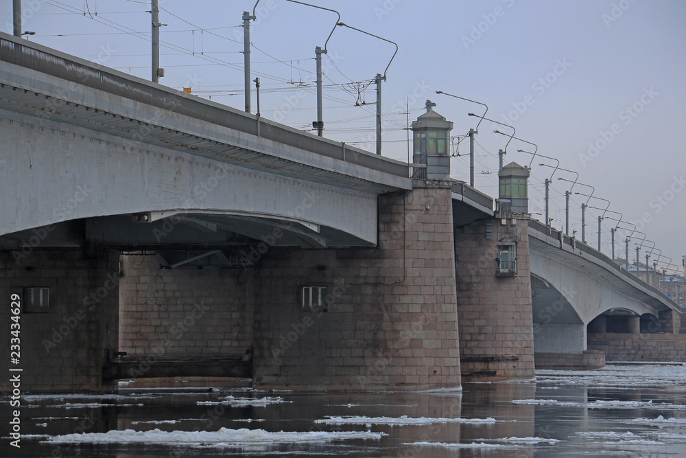 bridge over the river with floating ice floes bridge over the river with floating ice floes