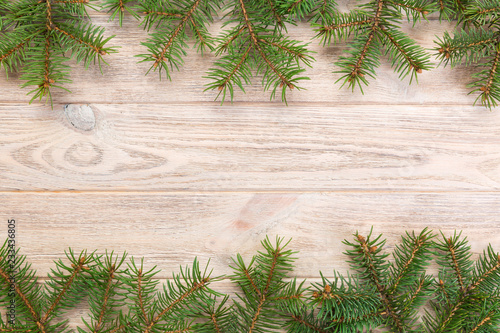 Christmas gray wooden background with fir tree and copy space. top view empty space for your design