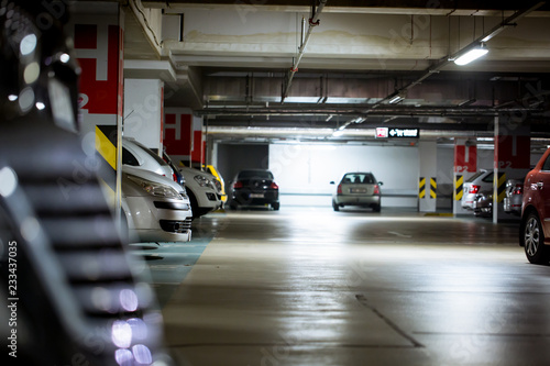 Underground parking / garage with huge arrange of cars © Khaligo