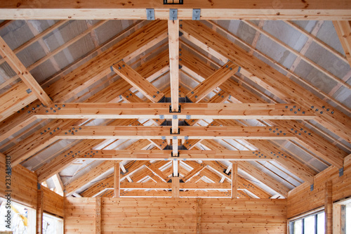 roof construction of big wooden trusses closeup