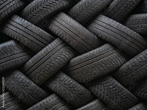Used auto tires stacked in piles.