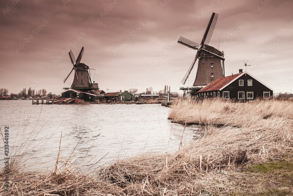 Wooden windmills on Zaan river coast