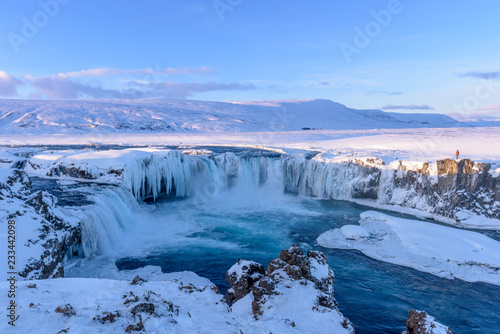 Frozen Godafoss waterfall on cold winters day at dawn, Northern Iceland © Philip