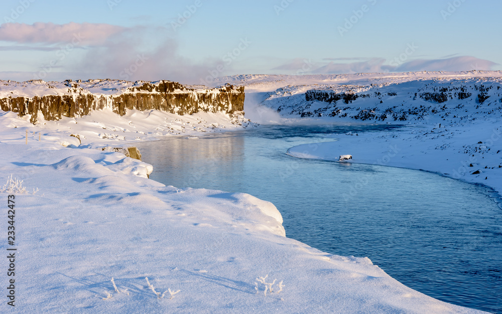 Jokulsa a Fjollum river near Dettifoss water at dawn on cold, snowy winters morning