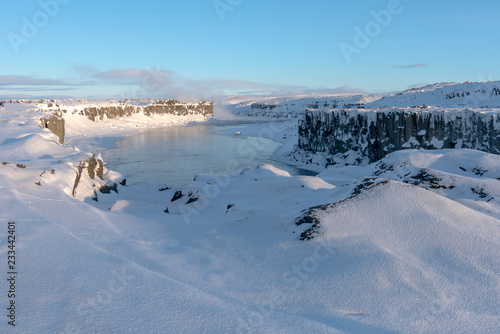 Jokulsa a Fjollum river near Dettifoss water at dawn on cold, snowy winters morning photo