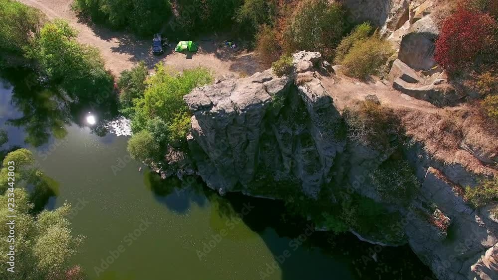 tent on the bank of river with crags, 4K aerial view of autumn canyon, mountain river in canyon with tents, River flowing among rocks in autumn, tent on the autumn river bank tent on the bank of river with crags, 4K aerial view of autumn canyon, mountain river in canyon with tents, River flowing among rocks in autumn, tent on the autumn river bank