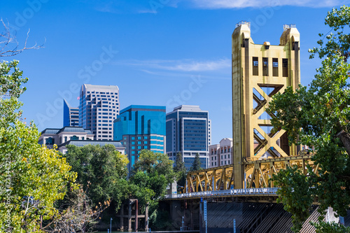 View towards the Tower Bridge and the skyscrapers in downtown Sacramento on a sunny day; California photo