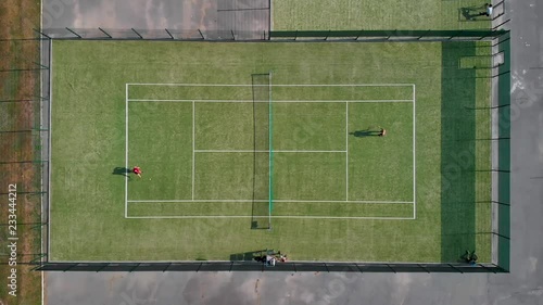 People play tennis top view