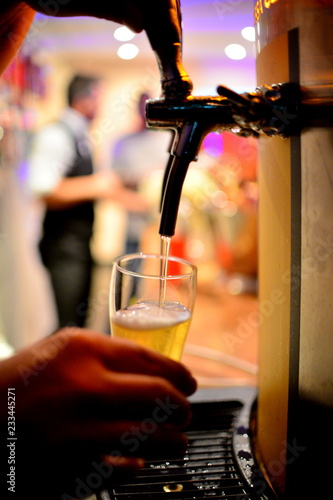 filling glass with beer