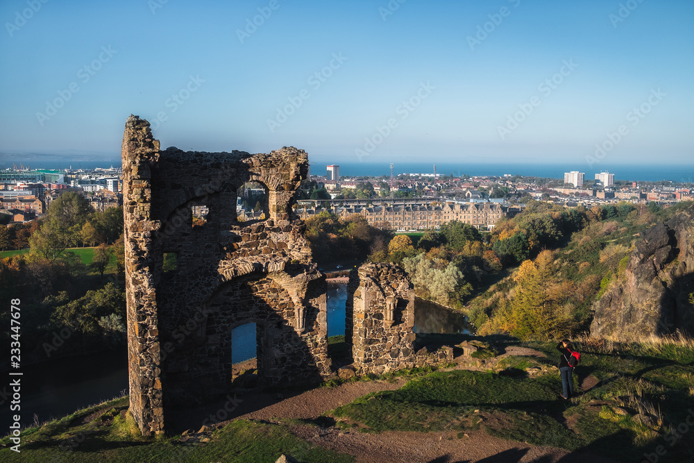 View on the old ruined chapel and city Edinburgh. The only building in the central area of Edinburgh's Holyrood Park is St Anthony's Chapel. Scotland View on the old ruined chapel and city Edinburgh. The only building in the central area of Edinburgh's Holyrood Park is St Anthony's Chapel. Scotland