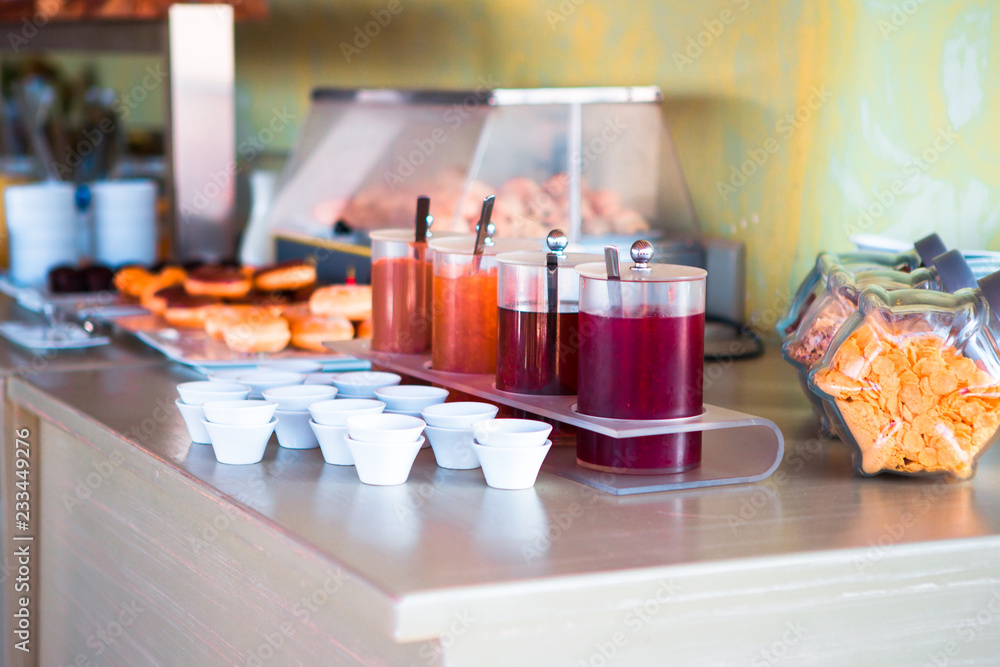 Fresh and delisious breakfast in outdoor cafe. Different choice of juices on table Fresh and delisious breakfast in outdoor cafe. Different choice of juices on table