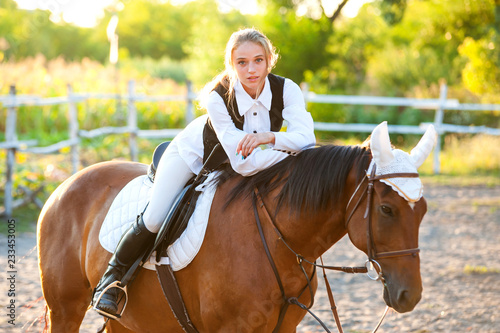 Girl equestrian rider riding a beautiful horse. Horse theme   © Rakursstudio