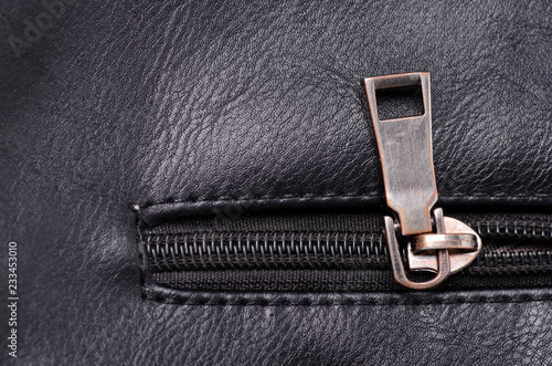 Black leather material texture fashion metal accessory fittings on background