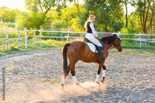 Girl equestrian rider riding a beautiful horse. Horse theme 