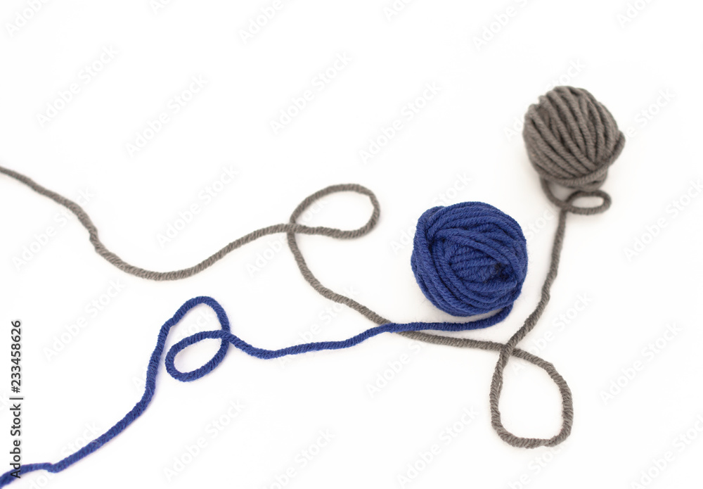 Balls of Wool Close Up on White Background , Blue and Gray Wool Isolated Balls of Wool Close Up on White Background , Blue and Gray Wool Isolated