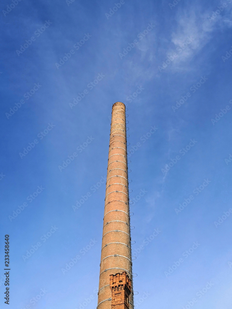 old industrial chimney made of brick