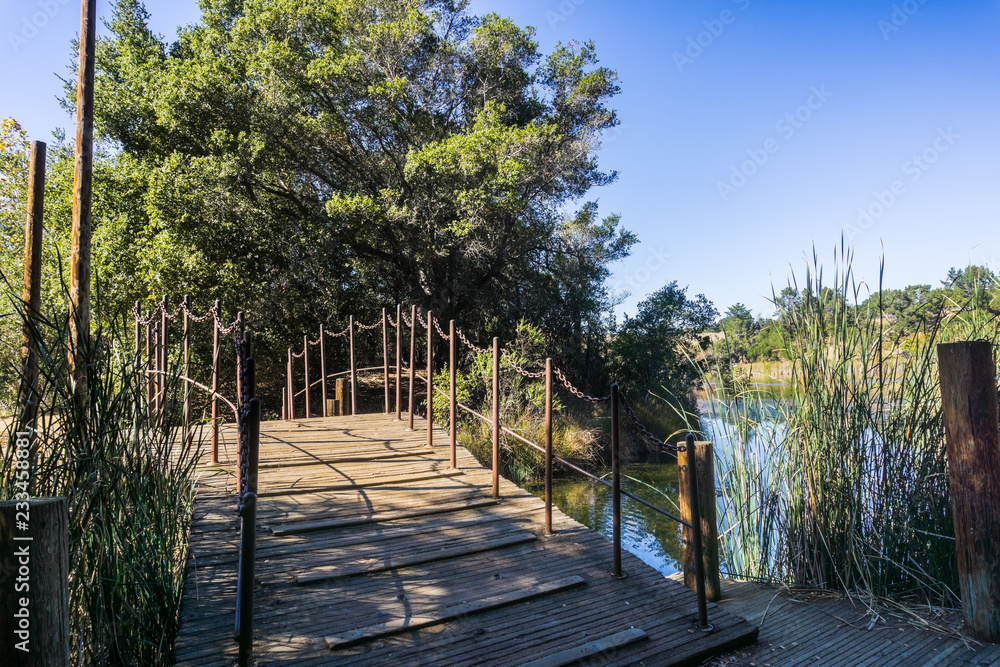Bridge over Boronda lake in Palo Alto Foothills Park, San Francisco bay area, California