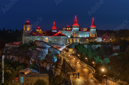 View of the castle in Kamenetz Podilsky on night. Ukraine photo