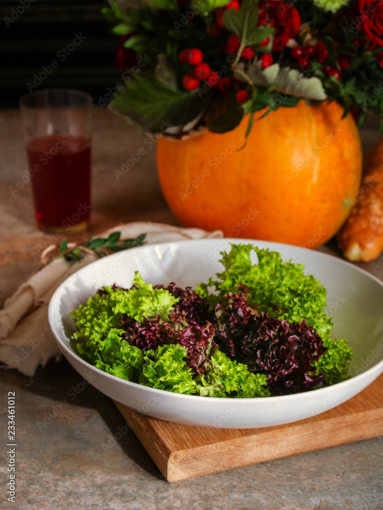 fresh lettuce leaves salad in a white plate on a wooden table background. top view. copy space fresh lettuce leaves salad in a white plate on a wooden table background. top view. copy space