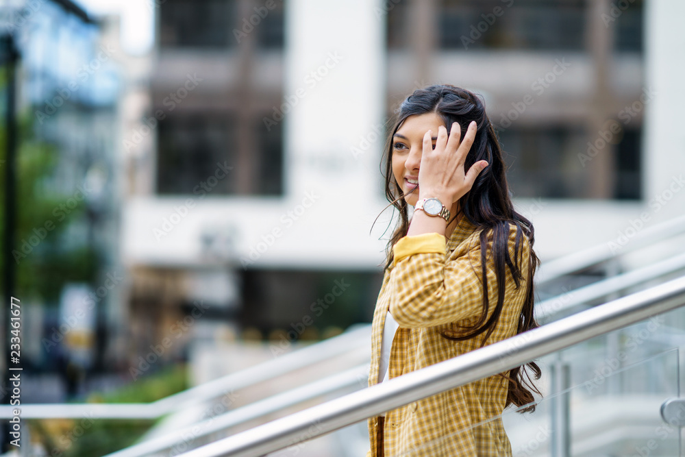 Fototapeta premium Businesswoman walking down steps outdoors