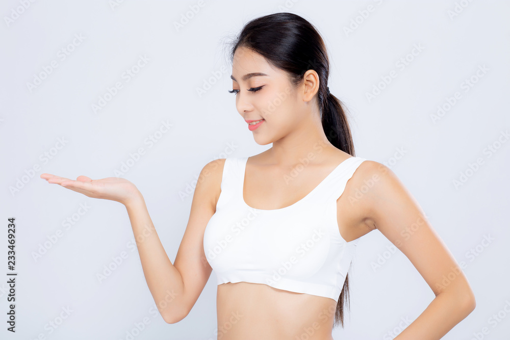 Portrait asian woman smiling beautiful body diet with fit presenting something empty copy space on the hand isolated on white background, model girl weight slim with calories, health concept. Portrait asian woman smiling beautiful body diet with fit presenting something empty copy space on the hand isolated on white background, model girl weight slim with calories, health concept.