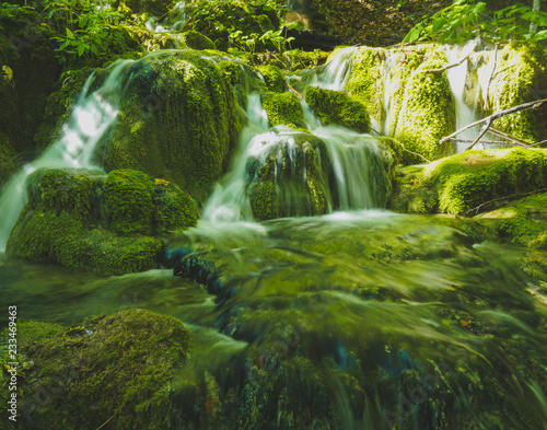 small waterfalls on green scenary