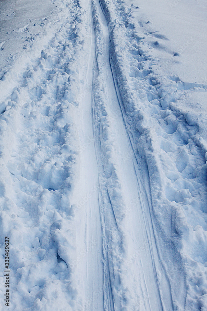 Winter. Ski tracks on the blue snow