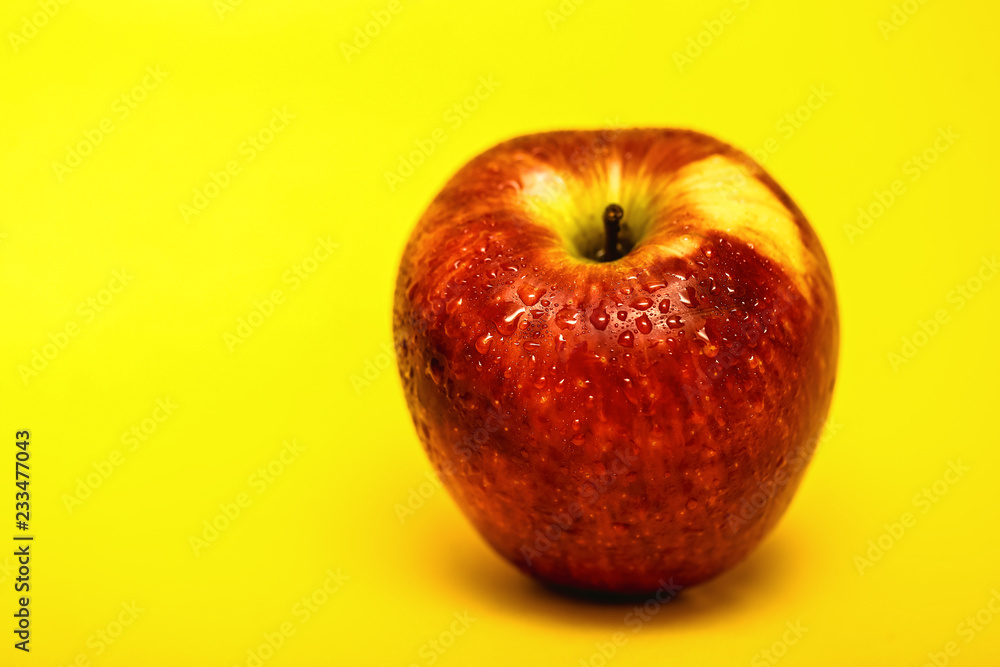 big red apple with yellow background, isolated. big red apple with yellow background, isolated.