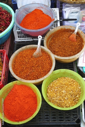 Fototapeta Naklejka Na Ścianę i Meble -  Colorful ground herbs and spices for sale at a market in rural Laos