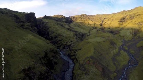 Drone show of valley with Seljavallalaug hidden swimming pool in Iceland. photo