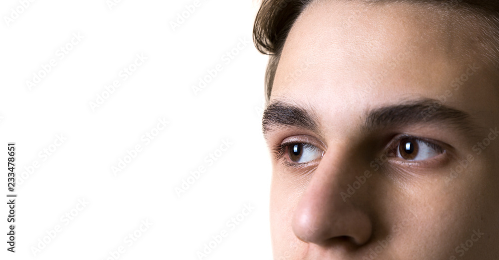 Fototapeta premium The eyes of the young man, a teenager. Close-up. Isolated on white background