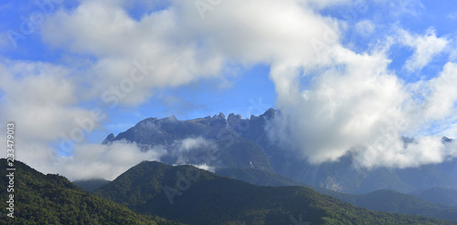 Mount Kinabalu during blue sky with cloud formation 