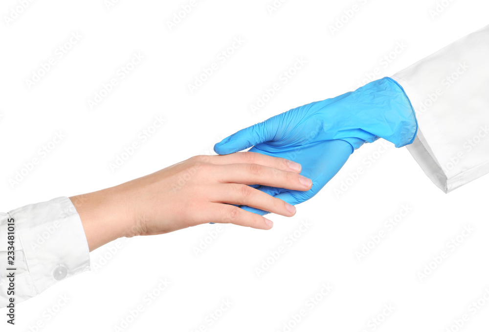 Doctor in medical glove holding hands with patient on white background Doctor in medical glove holding hands with patient on white background