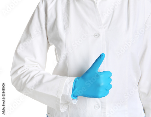 Doctor in medical glove showing thumb-up gesture on white background