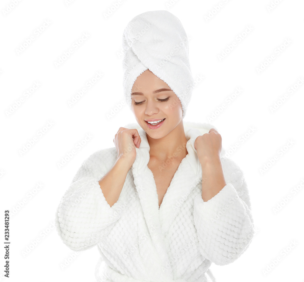 Portrait of young pretty woman in bathrobe with towel on white background Portrait of young pretty woman in bathrobe with towel on white background
