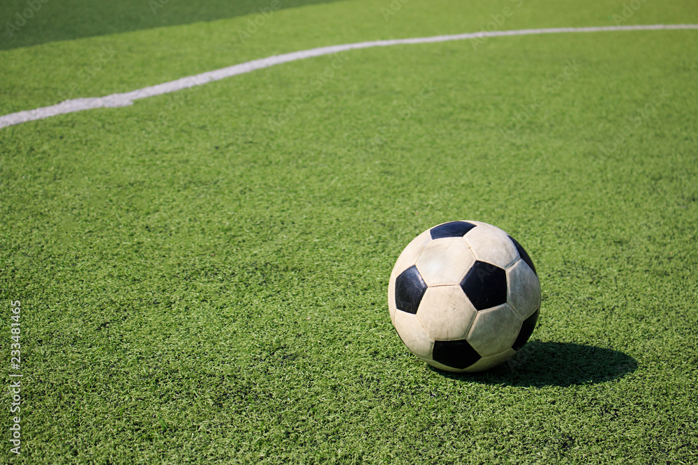 Football on artificial turf. It is for green background in a stadium Football on artificial turf. It is for green background in a stadium