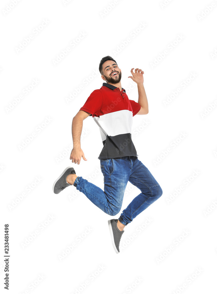 Handsome young man jumping on white background Handsome young man jumping on white background